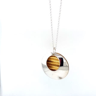 "Silver pebble with 24ct gold Necklace" available at Artifex 