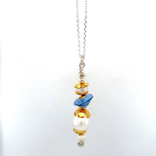"Gold plated stacked with synthetic blue spinel necklace" available at Artifex 