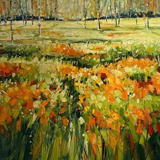 Orange Flower meadow with with trees in the background