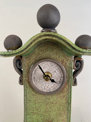 "Raku Clock with Pendulum" available at Artifex 