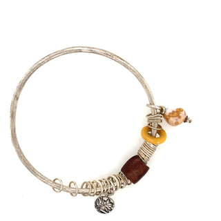 "Silver Bangle with stones wood & charms" available at Artifex 